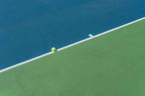 Tennis ball on the field line meaning it is not out