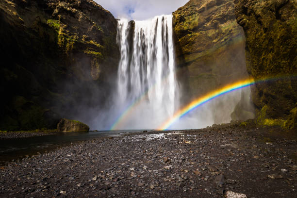istock Skogafoss - May 04, 2018: Rainbows at the Skogafoss waterfall, Iceland 1015604582