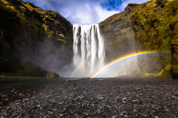 istock Skogafoss - May 04, 2018: Rainbows at the Skogafoss waterfall, Iceland 1015604670