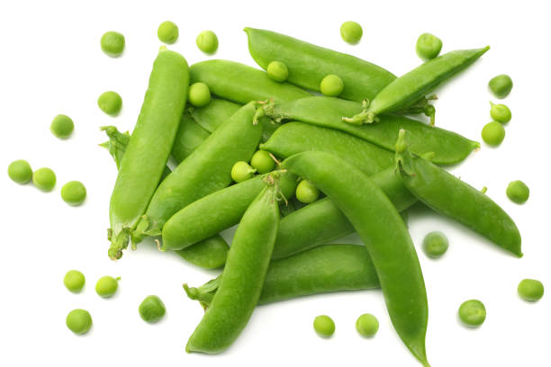 istock fresh green peas isolated on white background. top view 1015620956