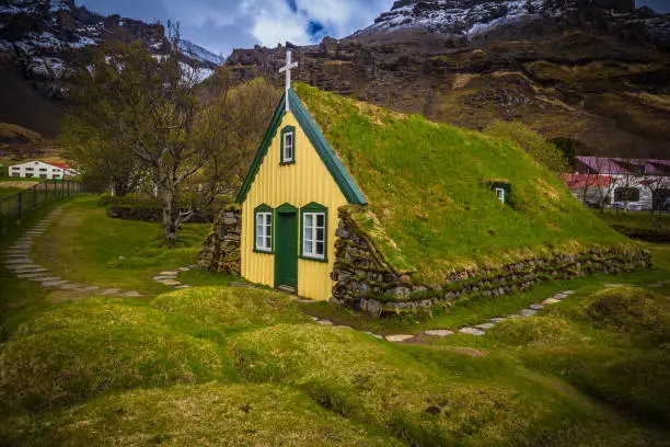 Photo of Hof - May 05, 2018: Turf church in the town of Hof, Iceland