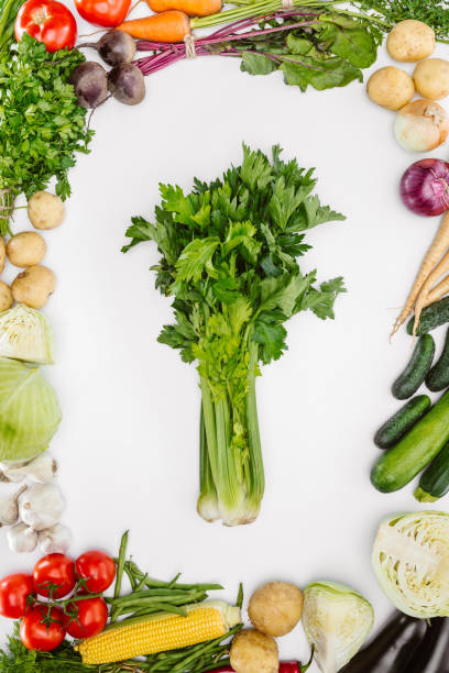 istock flat lay with various seasonal ripe vegetables with celery in middle isolated on white 1015632336