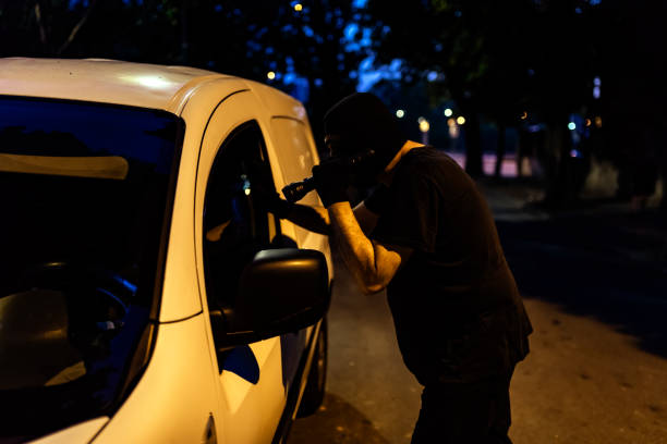 istock Car Burglar Stealing the Vehicle 1015634870