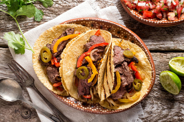 Grilled Beef Fajitas Delicious grilled beef fajitas with steak, onion, bell peppers and jalapeno. fajita photos stock pictures, royalty-free photos & images