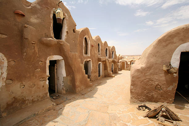 Tunisia, Medenine - Village near Matmata. This village has been rebuilt, respecting ancient atmosphere and can be visited by tourists now. cliff dwelling stock pictures, royalty-free photos & images