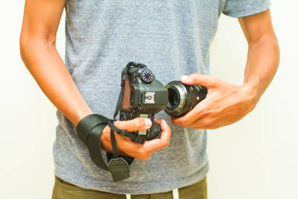 photographer holding camera, close-up. front view, Selective focus.