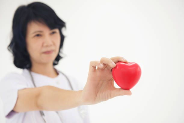 istock Nurses use hands to show heart shape concept 1015694980