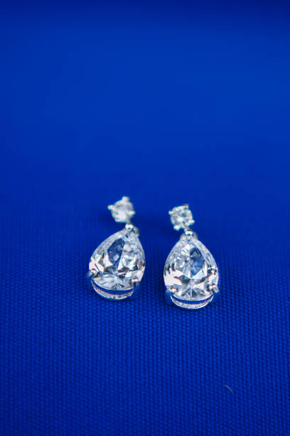 istock Ear Rings on purple 1015715502
