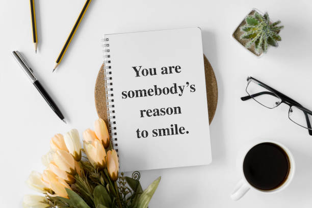 istock Notebook with wisdom quote and coffee cup. 1015723108
