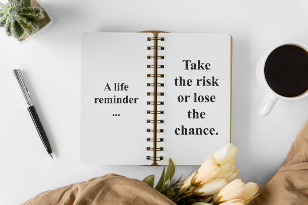 istock Notebook with wisdom quote and coffee cup. 1015723110