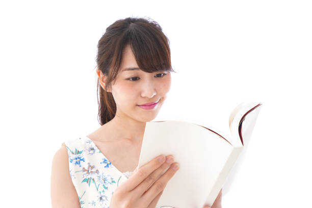 istock Young woman reading books 1015732970