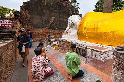 Ayutthaya, Thailand - July, 31, 2018 : Unidentified name foreign tourists have come to visit Wat Yai Chai Mongkol in day time at Ayutthaya Thailand.