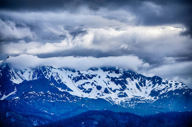 beautiful sunset and cloudsy landscape in alaska mountains