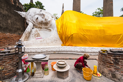 Ayutthaya, Thailand - July, 31, 2018 : Unidentified name tourist to visitat reclining buddha in Wat Yai Chaimongkol temple is in the city of Ayutthaya which is a popular tourist.Thailand
