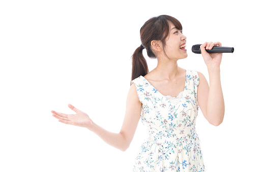 Young woman singing karaoke