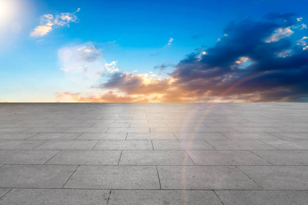 istock Empty square floor tiles with beautiful sky landscape 1015749522