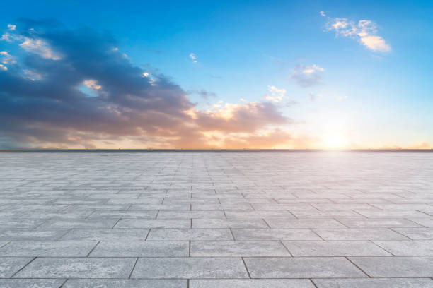 istock Empty square floor tiles with beautiful sky landscape 1015749560