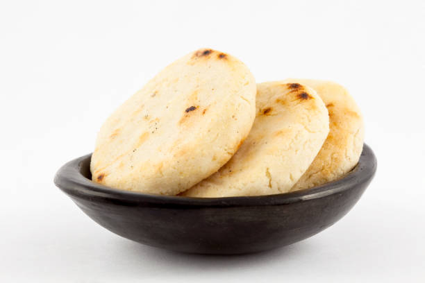 istock Roasted traditional South American corn arepa in a black ceramic dish 1015752082