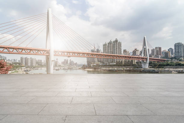 istock Urban,skyscrapers,with,empty,square,floor,tiles 1015757458