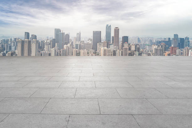 istock Urban,skyscrapers,with,empty,square,floor,tiles 1015757762