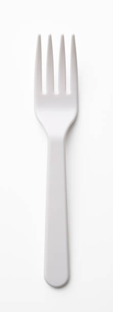 Isolated shot of white plastic fork on white background