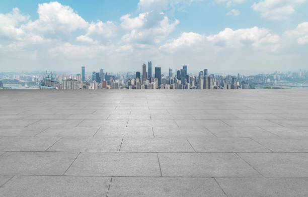 istock Urban,skyscrapers,with,empty,square,floor,tiles 1015762670