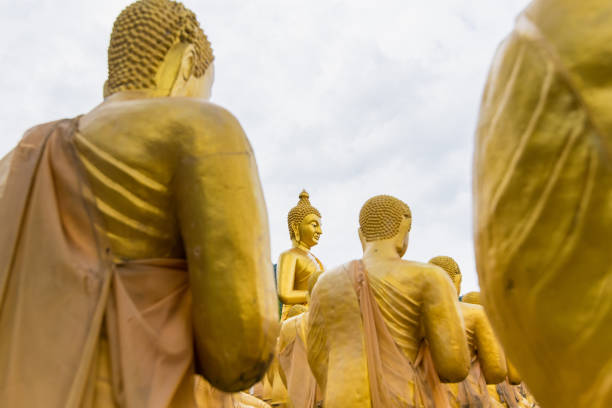 istock Sculpture Figures Buddhist Monks. Budha and 1250 Monks, at Phuttha Utthayan Makha Bucha Anusorn Nakhon Nayok, Thailand. 1015762904