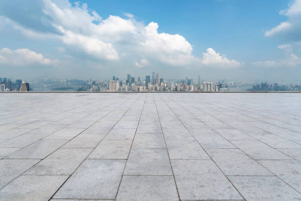 istock Urban,skyscrapers,with,empty,square,floor,tiles 1015767934