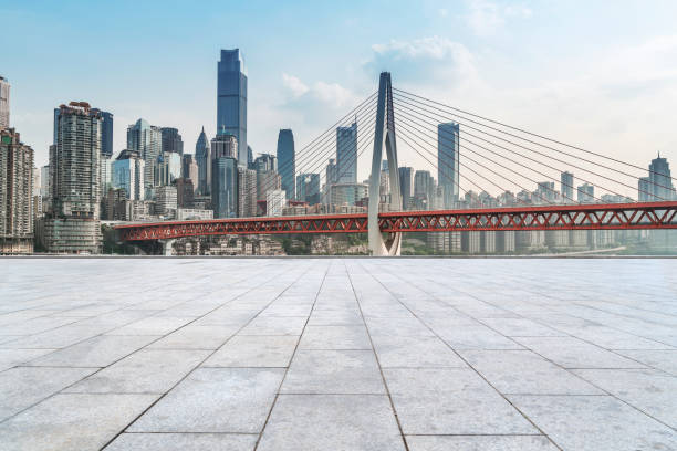 istock Urban,skyscrapers,with,empty,square,floor,tiles 1015768634