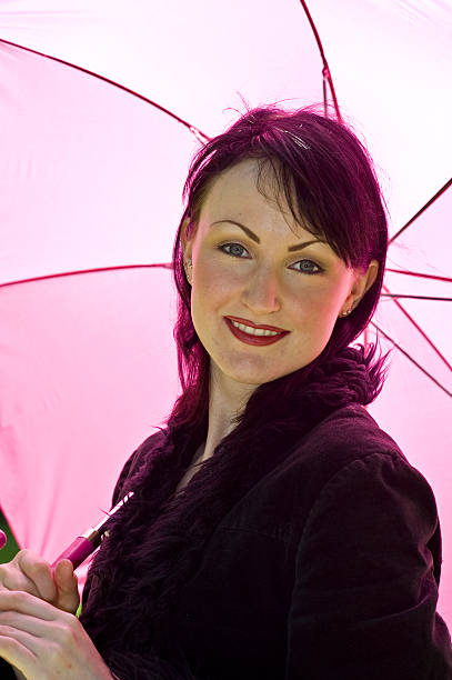 istock Pretty woman with pink umbrella 101577324