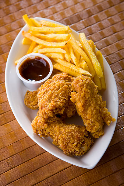 istock chicken wing with french fries 101578244