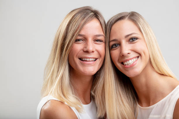 istock Two happy smiling young blond women 1015792064