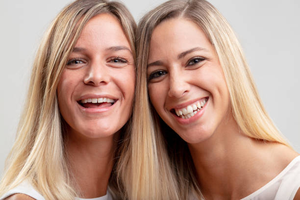 istock Two pretty happy young blond women 1015792072