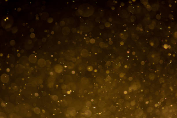 istock Abstract gold bokeh with black background 1015797546