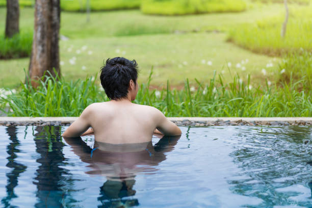 istock man playing in the swimming pool 1015802252