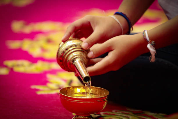 pour water of dedication to make a libation In Thai tradition