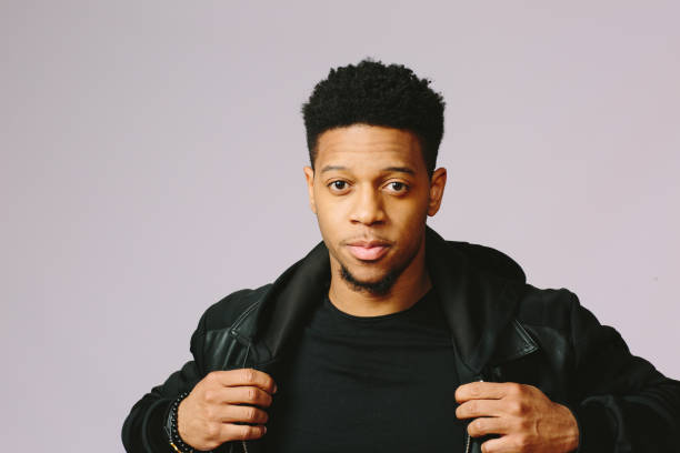 istock Close up portrait of a cool guy holding his jacket 1015812590