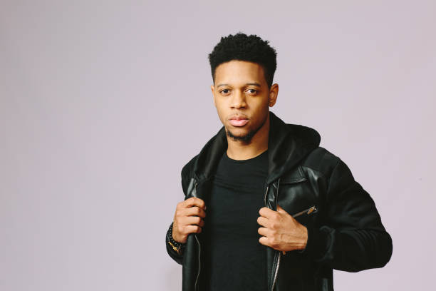 istock Cool young man holding his leather jacket 1015812598