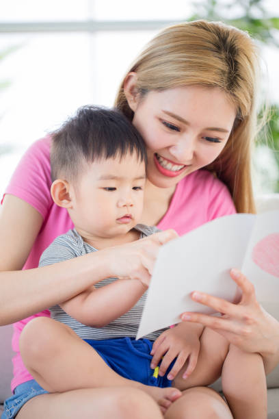 istock mom read book with son 1015812942