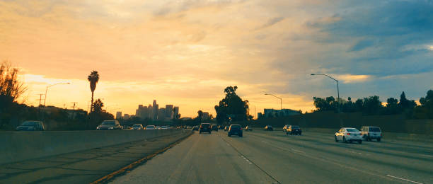 istock Driving through Los Angeles freeway towards the sunset 1015812994