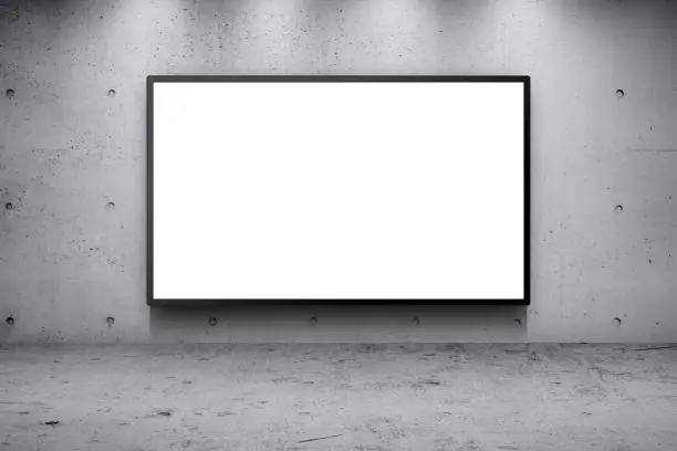 Photo of Blank advertising billboard led panel on concrete wall building street roadside background