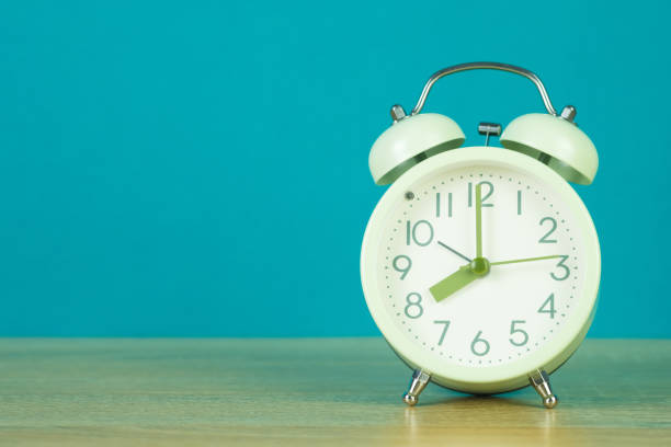 istock Retro vintage alarm clock on wood table, time concept. 1015823464