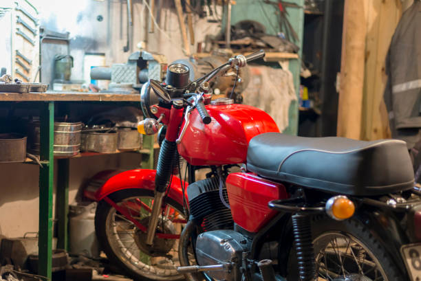 Red vintage retro motorcycle parked in the garage
