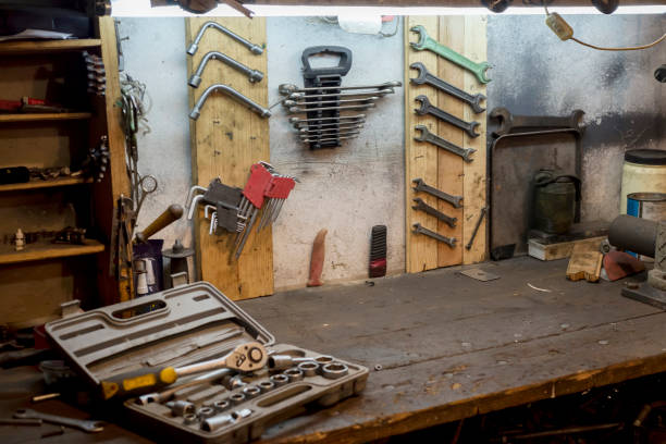 Work tools on the garage wall and work table A set of working tools on the garage wall and work desk bike workshop stock pictures, royalty-free photos & images