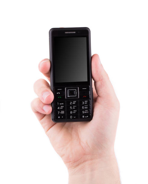 istock Hand holds black cell phone. 1015849144