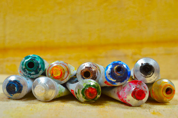 Close view of color tubes isolated on a wooden background