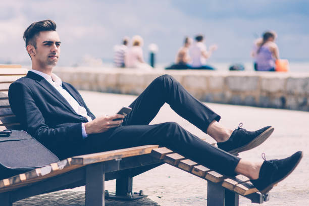 istock Pensive handsome manager relaxing on lounge chair 1015855172