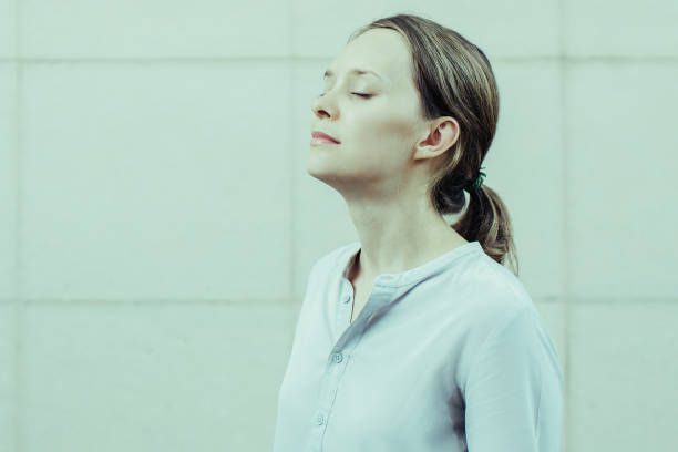 istock Serene young woman with closed eyes meditating 1015859322