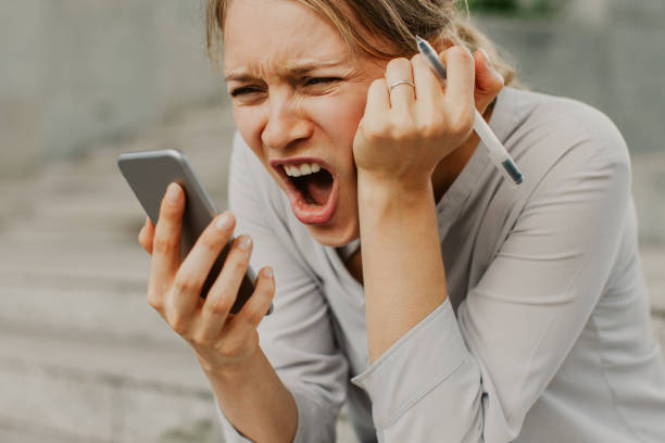 istock Stressed businesswoman recording audio message 1015859510