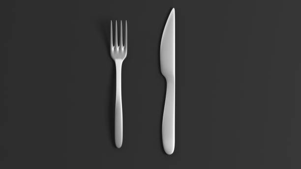 istock Fork and knife, isolated on black background. 1015864066
